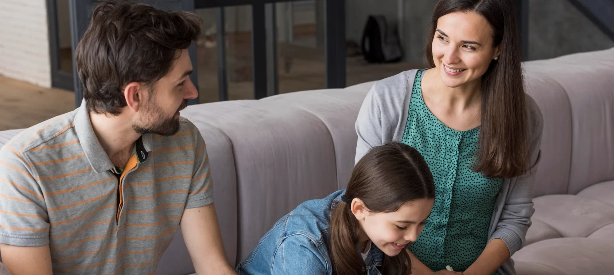 A caseworker talking with a family at home
