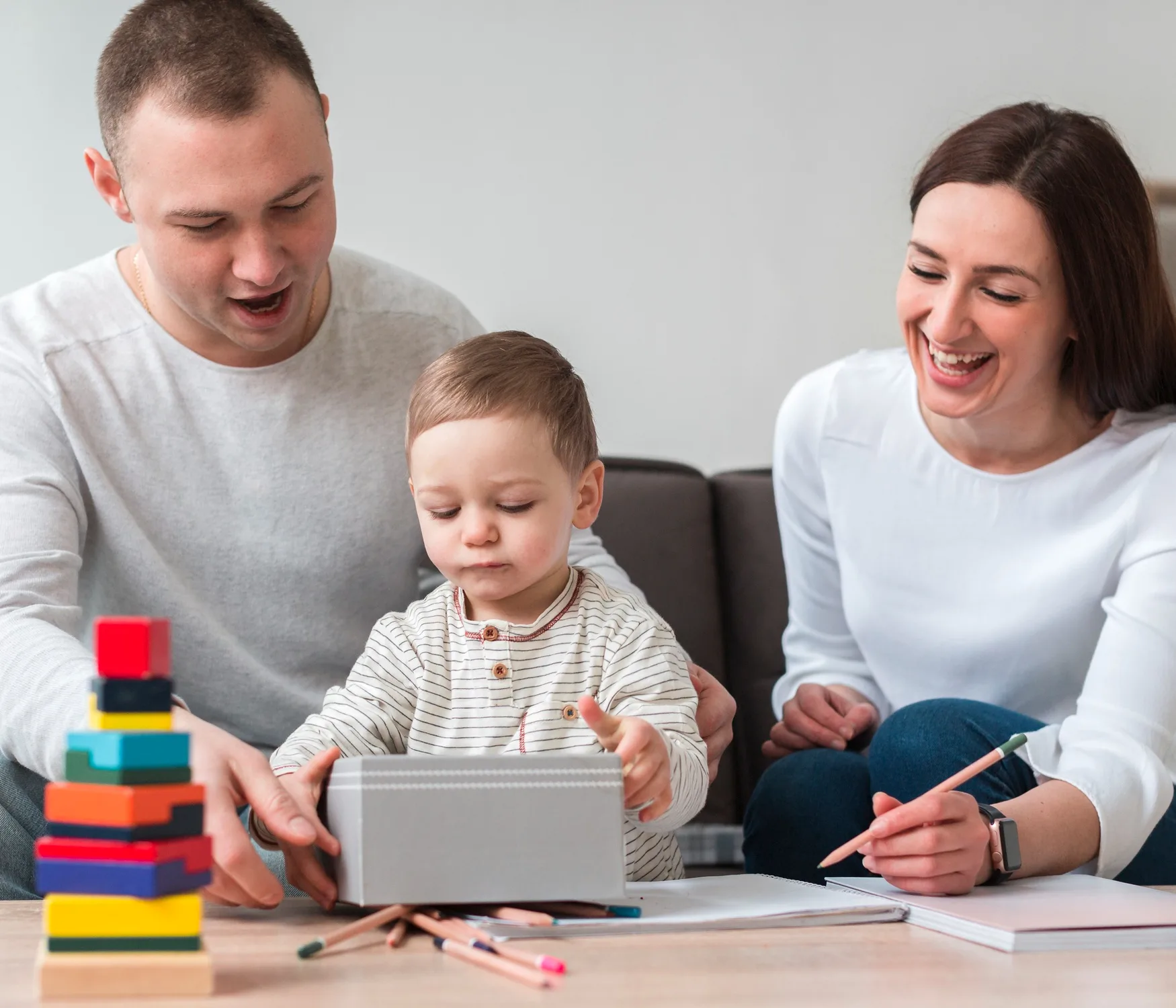 A parent and child reading a guide together