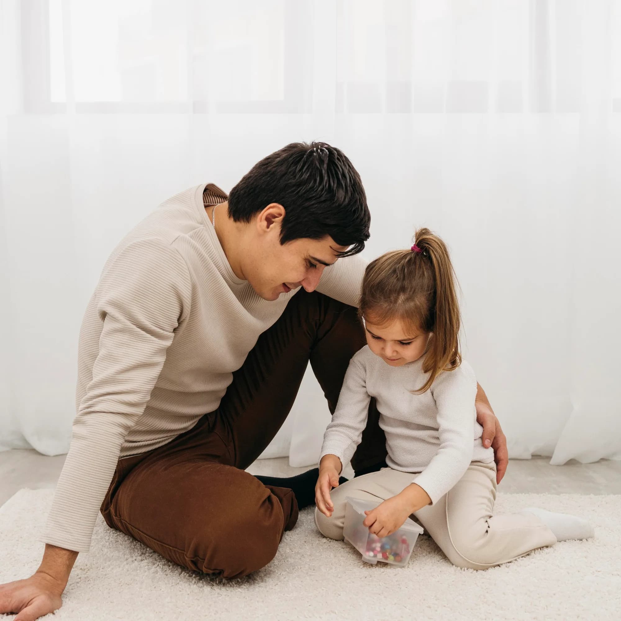 A father reading with his daughter