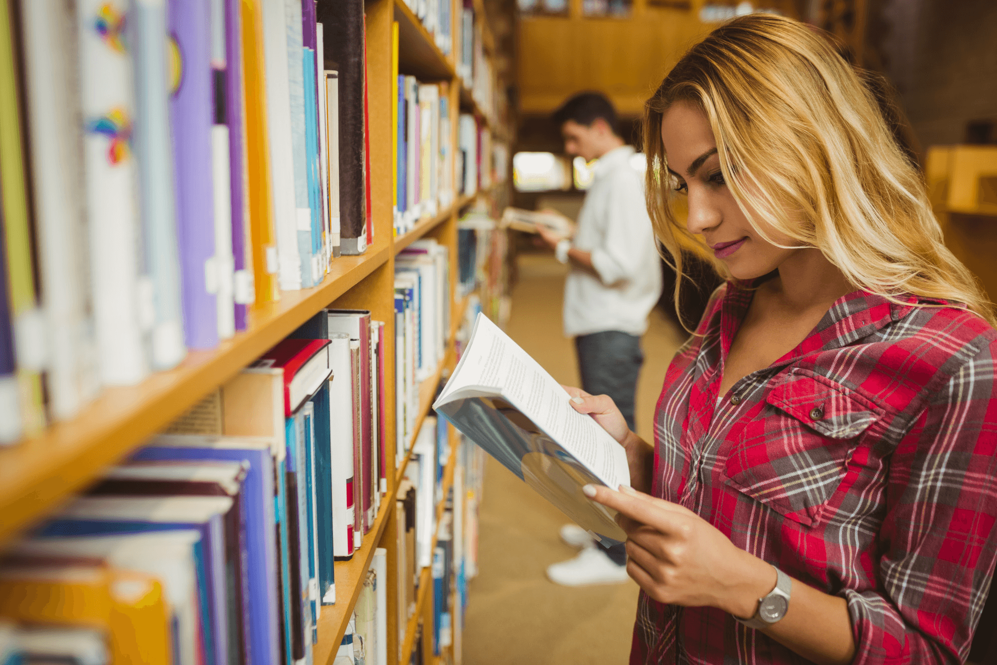 A parent browsing books in a library