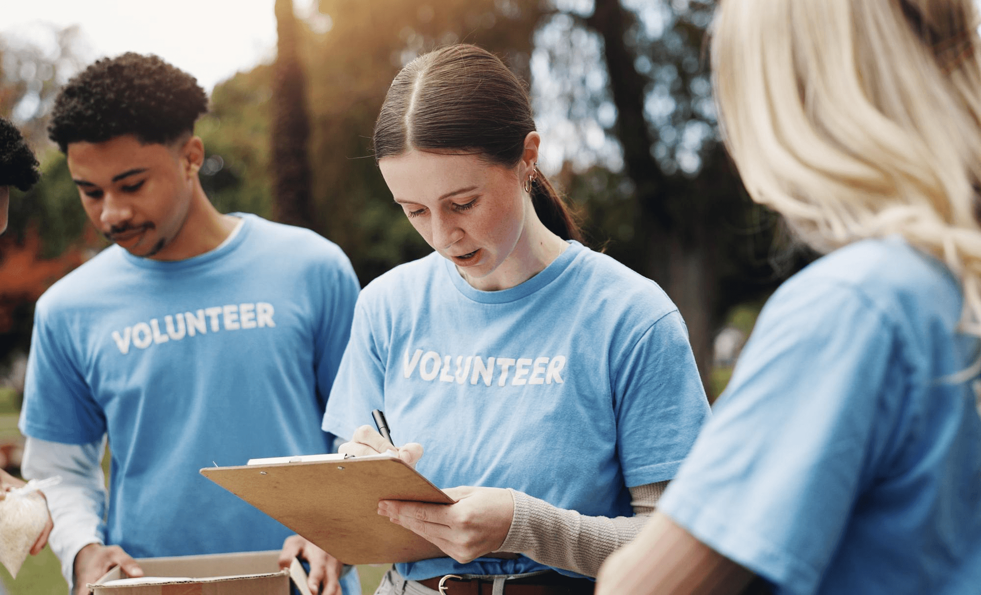 Volunteers working together at a community event